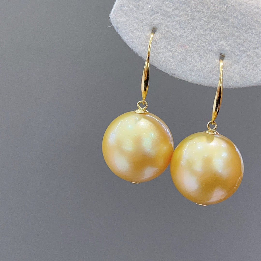 Luxe 15,6 mm Zuidzee gouden pareloorbellen in 18K goud - een must-have voor sieraden