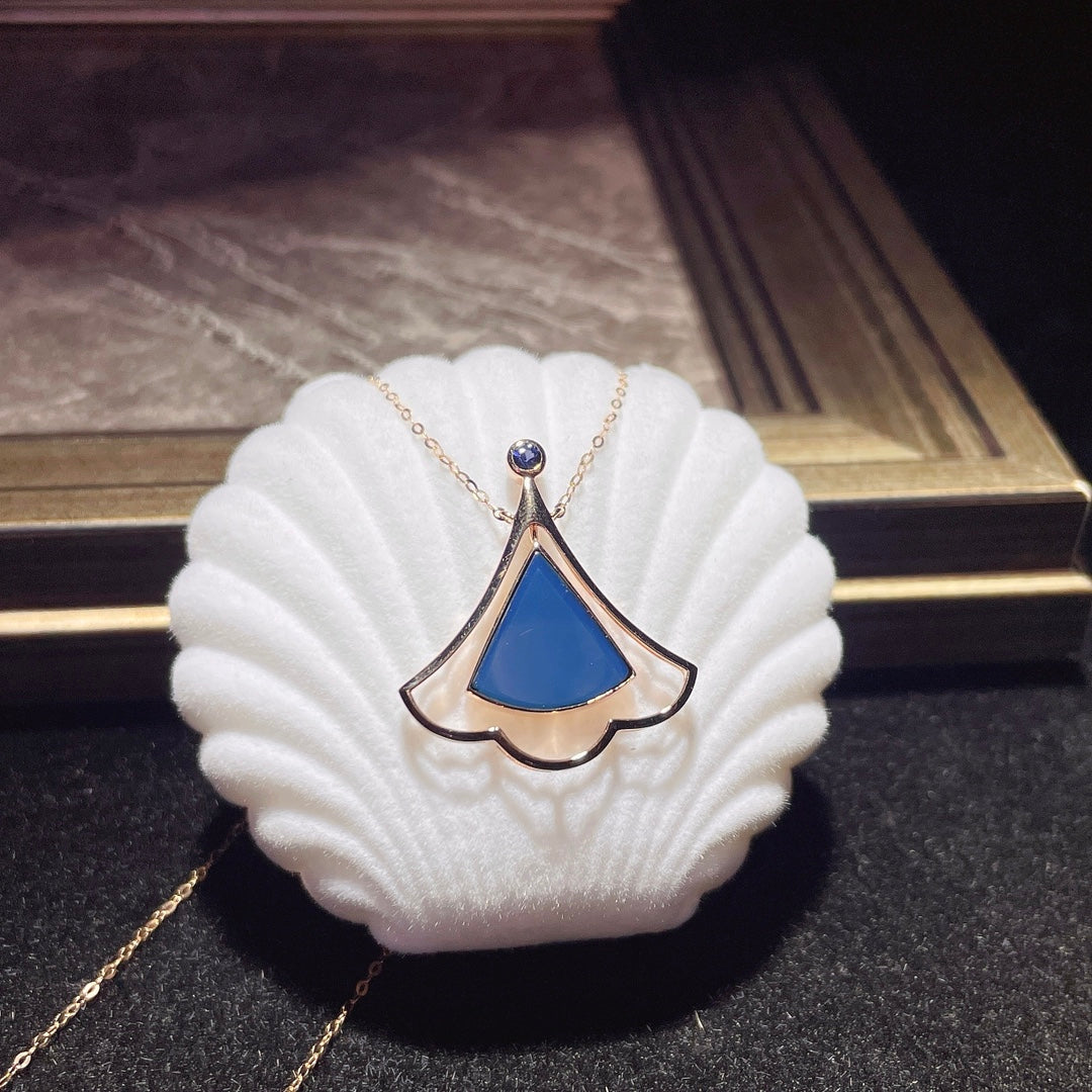 Jewelry Exclusive: 18K Gold Embedded Dominican Blue Amber Pendant