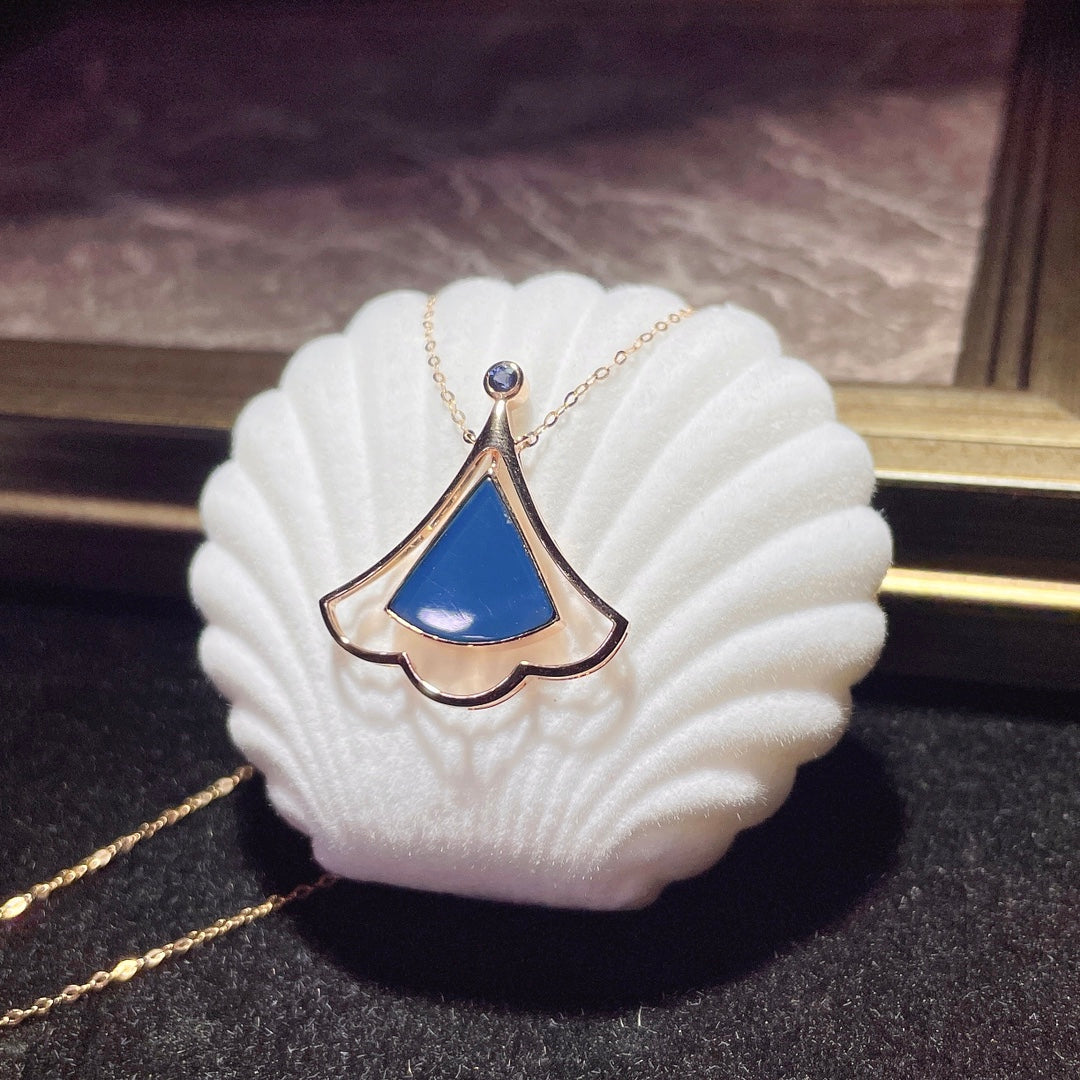 Jewelry Exclusive: 18K Gold Embedded Dominican Blue Amber Pendant
