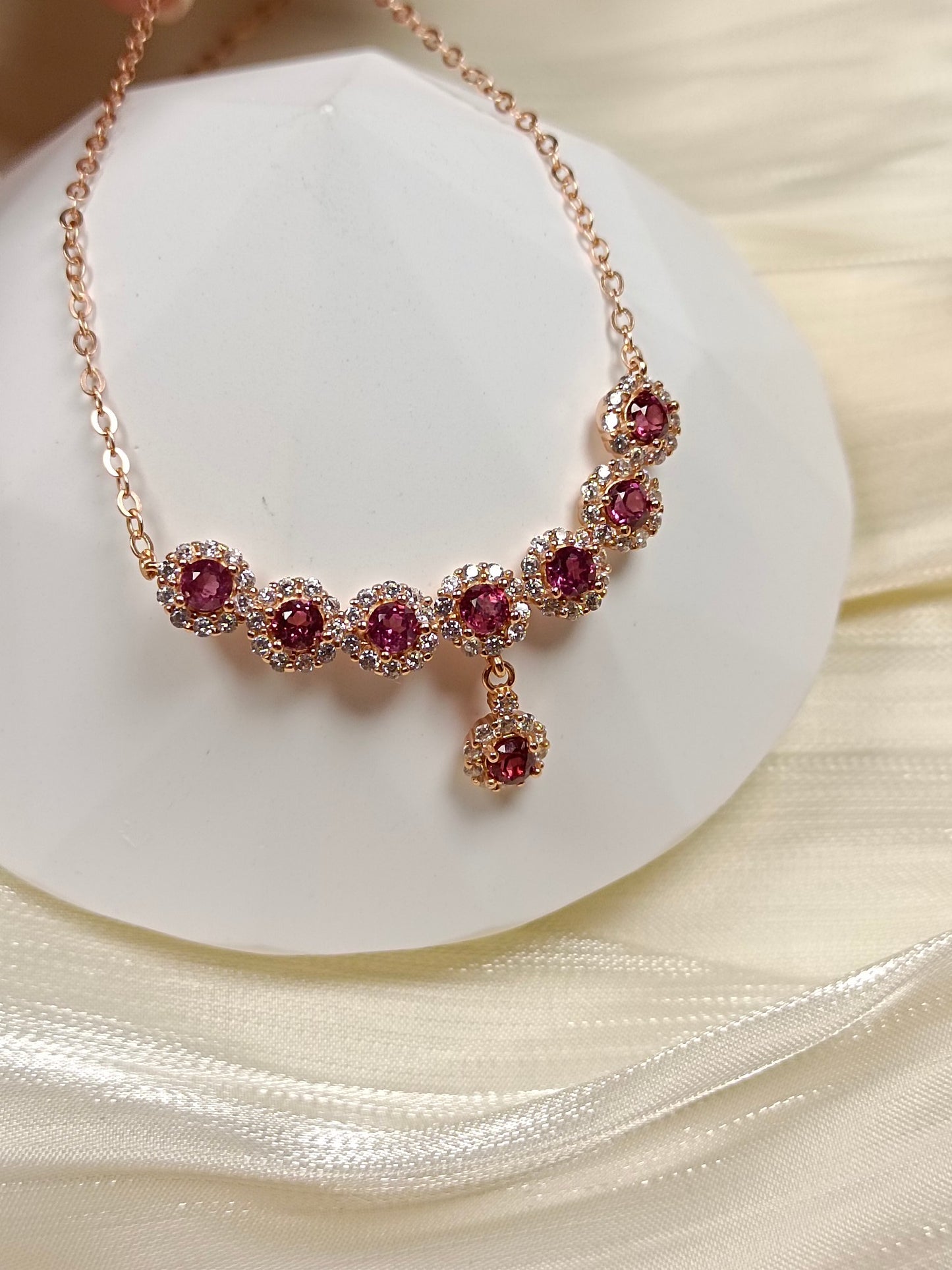 This S925 silver necklace features intricate craftsmanship, combining 925 sterling silver and purple garnet.
