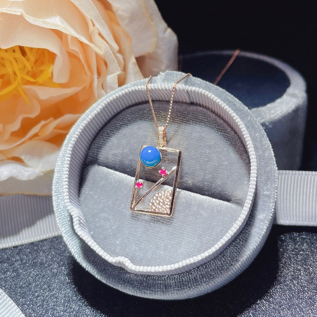 Exquis pendentif en ambre bleu dominicain incrusté d'or 18 carats - Bijoux pour rêves