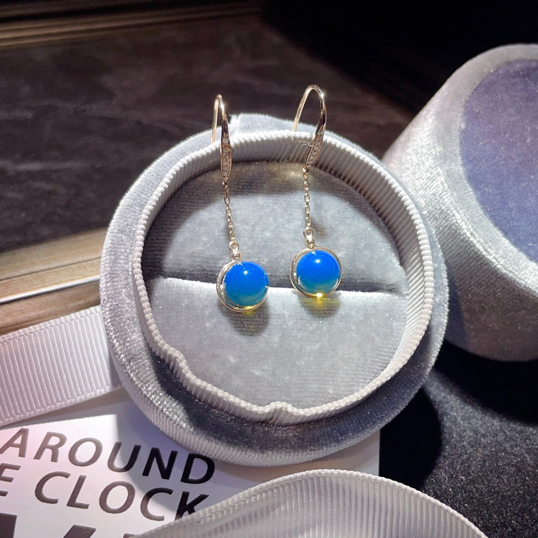 Exquisite Ohrringe aus 18-karätigem Gold mit eingebettetem dominikanischen blauen Bernstein – eine Begegnung mit der Natur