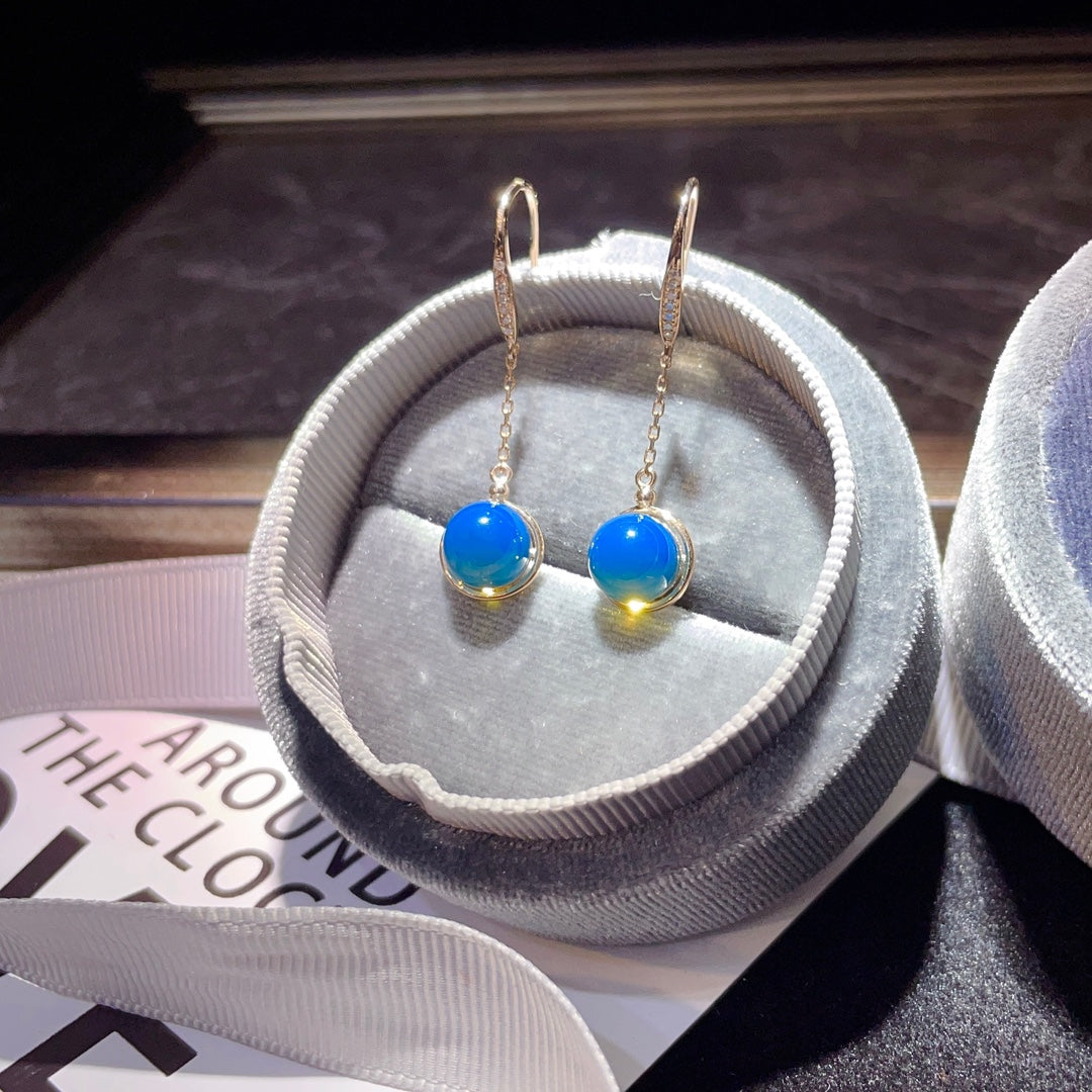 Exquisite Ohrringe aus 18-karätigem Gold mit eingebettetem dominikanischen blauen Bernstein – eine Begegnung mit der Natur