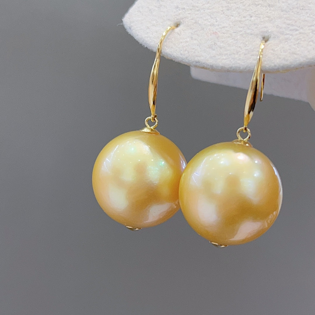 Luxe 15,6 mm Zuidzee gouden pareloorbellen in 18K goud - een must-have voor sieraden