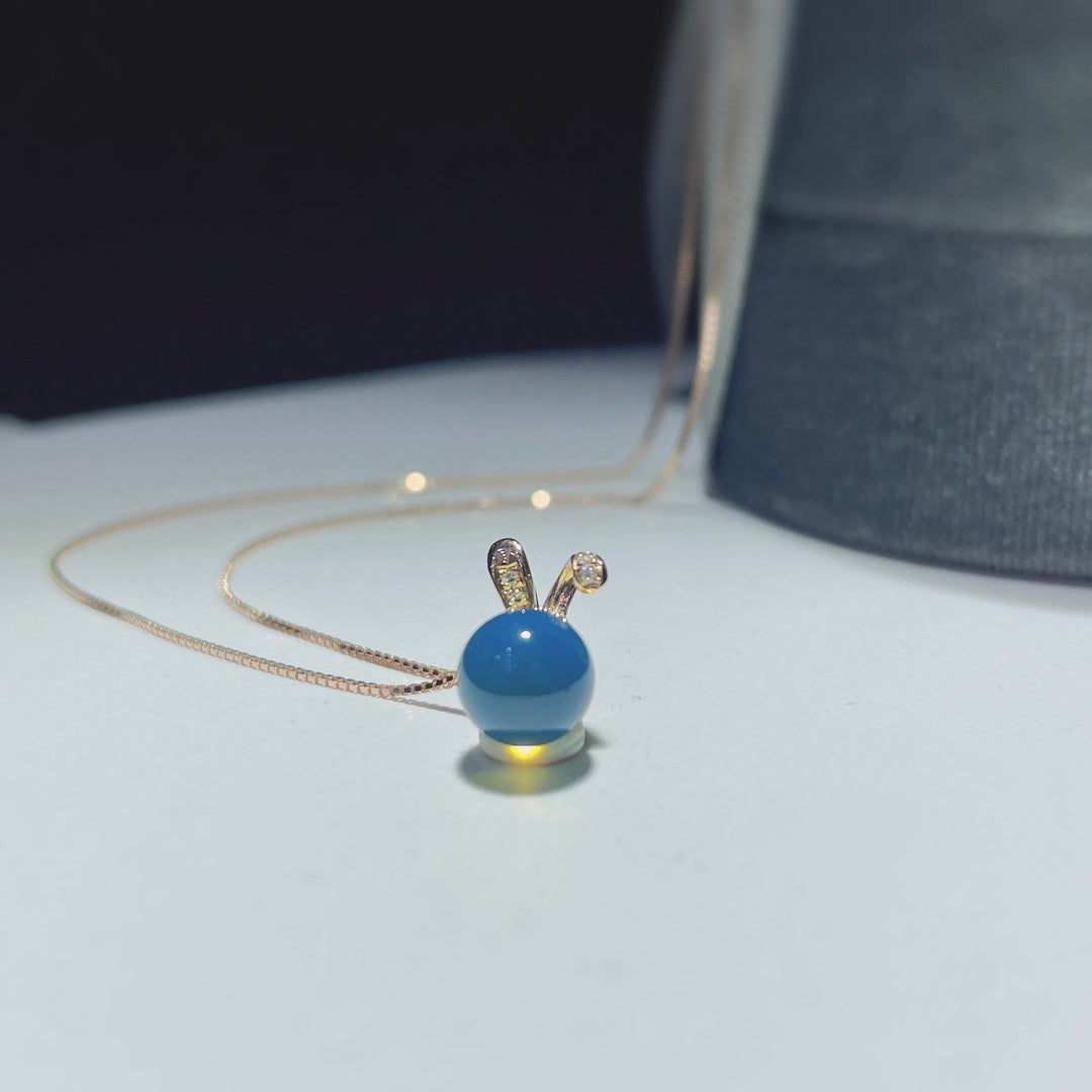 Autumn's Whisper Jewelry: 18k Gold Embedded Dominican Blue Amber Pendant with Adorable Rabbit
