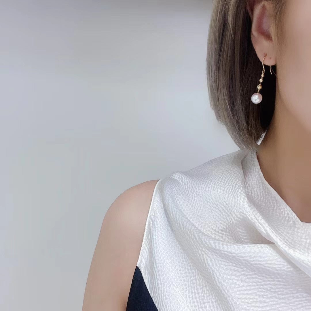 Elegant Companion: 18K Gold Laser-Cut Ball Earrings with Akoya Pearls