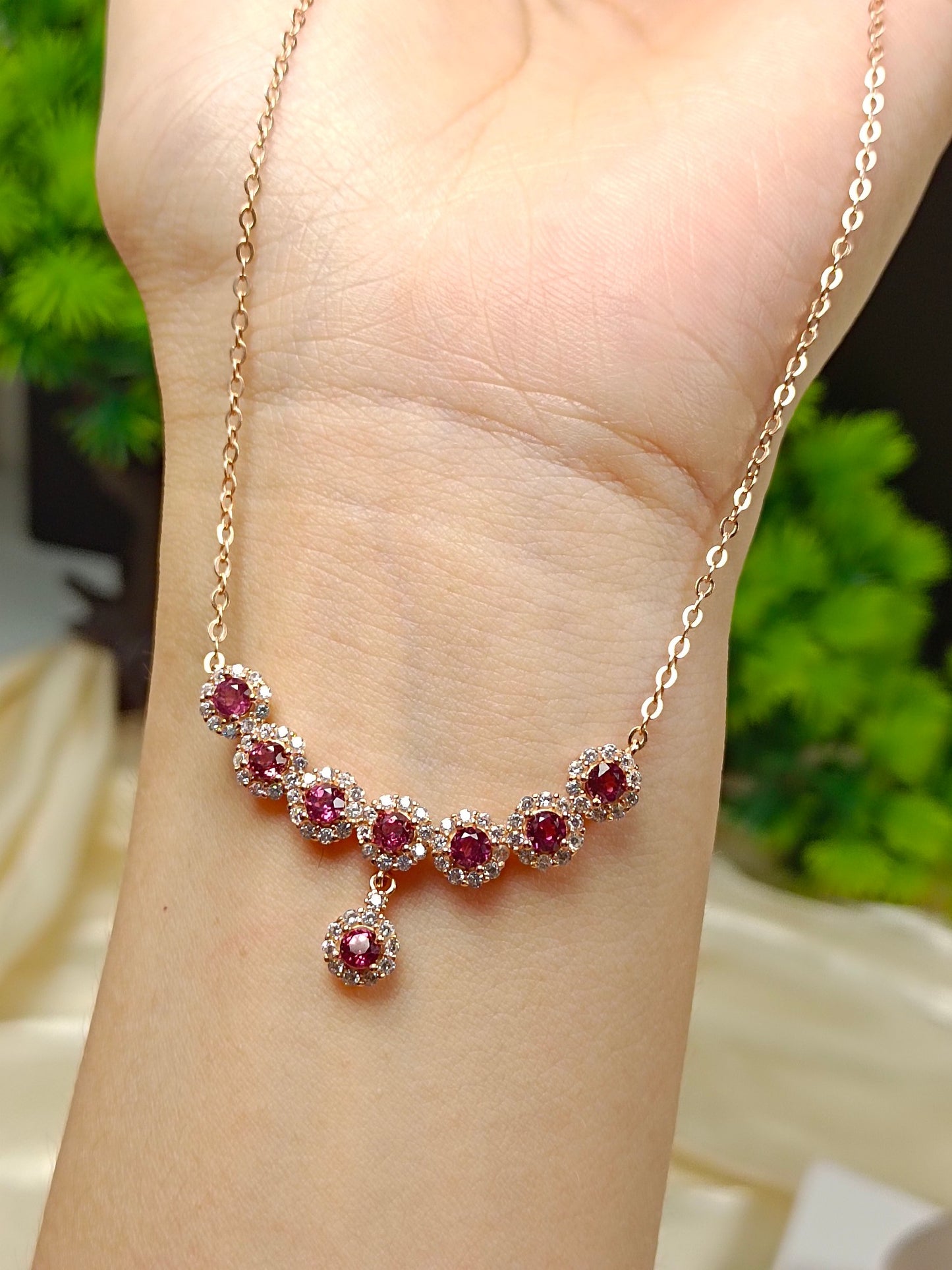 This S925 silver necklace features intricate craftsmanship, combining 925 sterling silver and purple garnet.