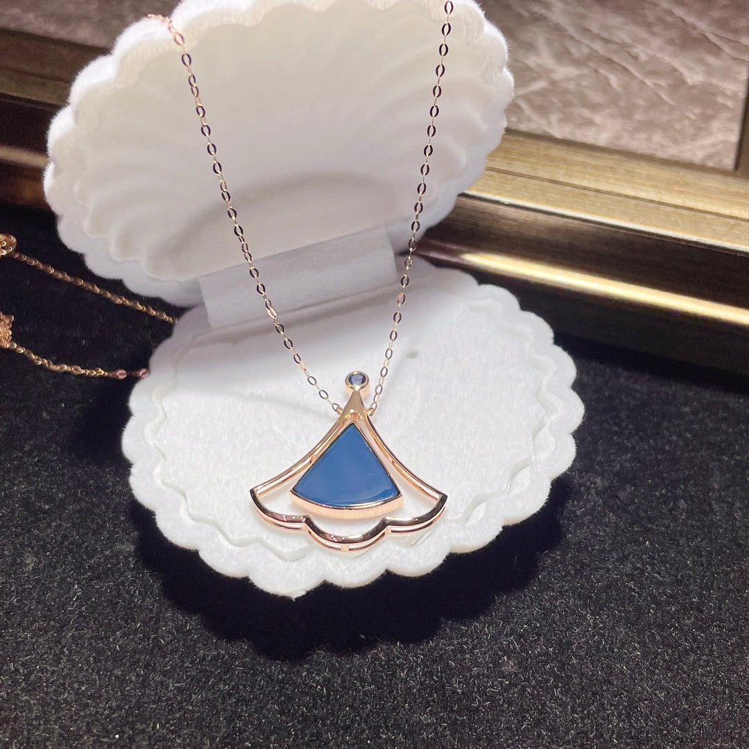 Jewelry Exclusive: 18K Gold Embedded Dominican Blue Amber Pendant