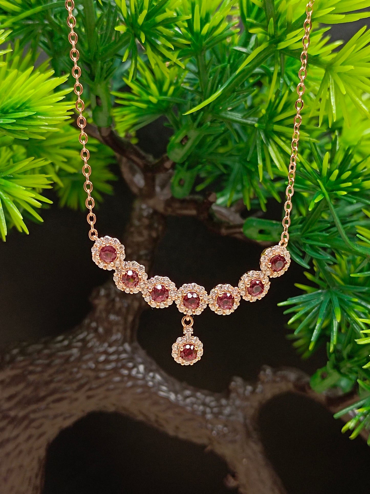 This S925 silver necklace features intricate craftsmanship, combining 925 sterling silver and purple garnet.