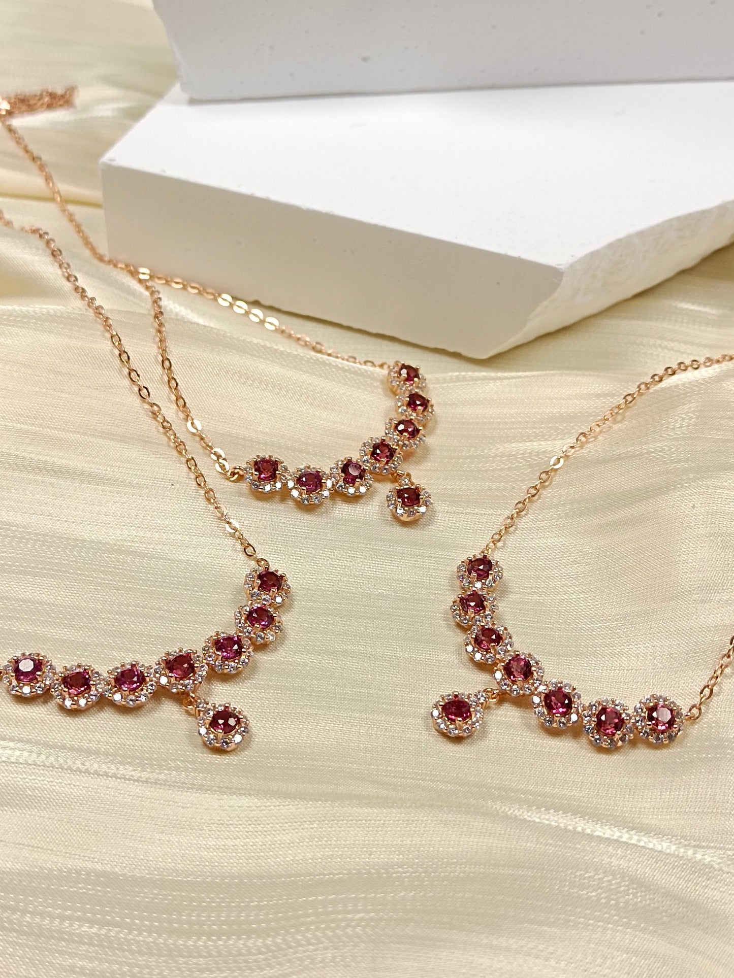 This S925 silver necklace features intricate craftsmanship, combining 925 sterling silver and purple garnet.