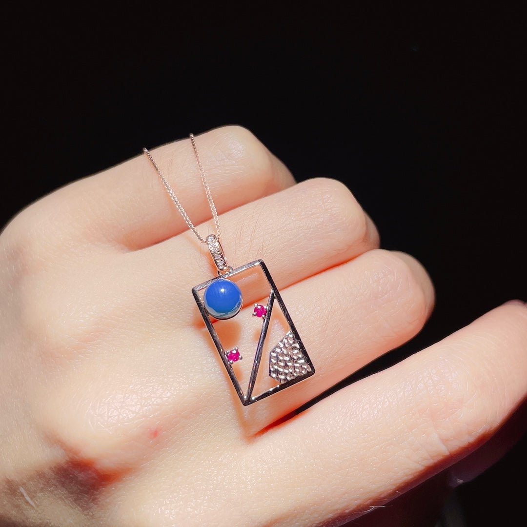 Exquis pendentif en ambre bleu dominicain incrusté d'or 18 carats - Bijoux pour rêves