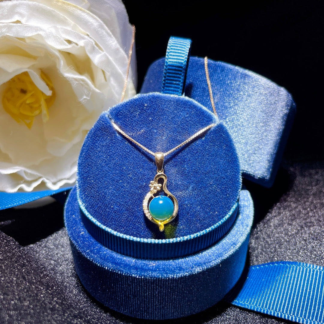 Exquisito Colgante de Ámbar Azul Dominicana Incrustado en Oro de 18K - Joyería Única