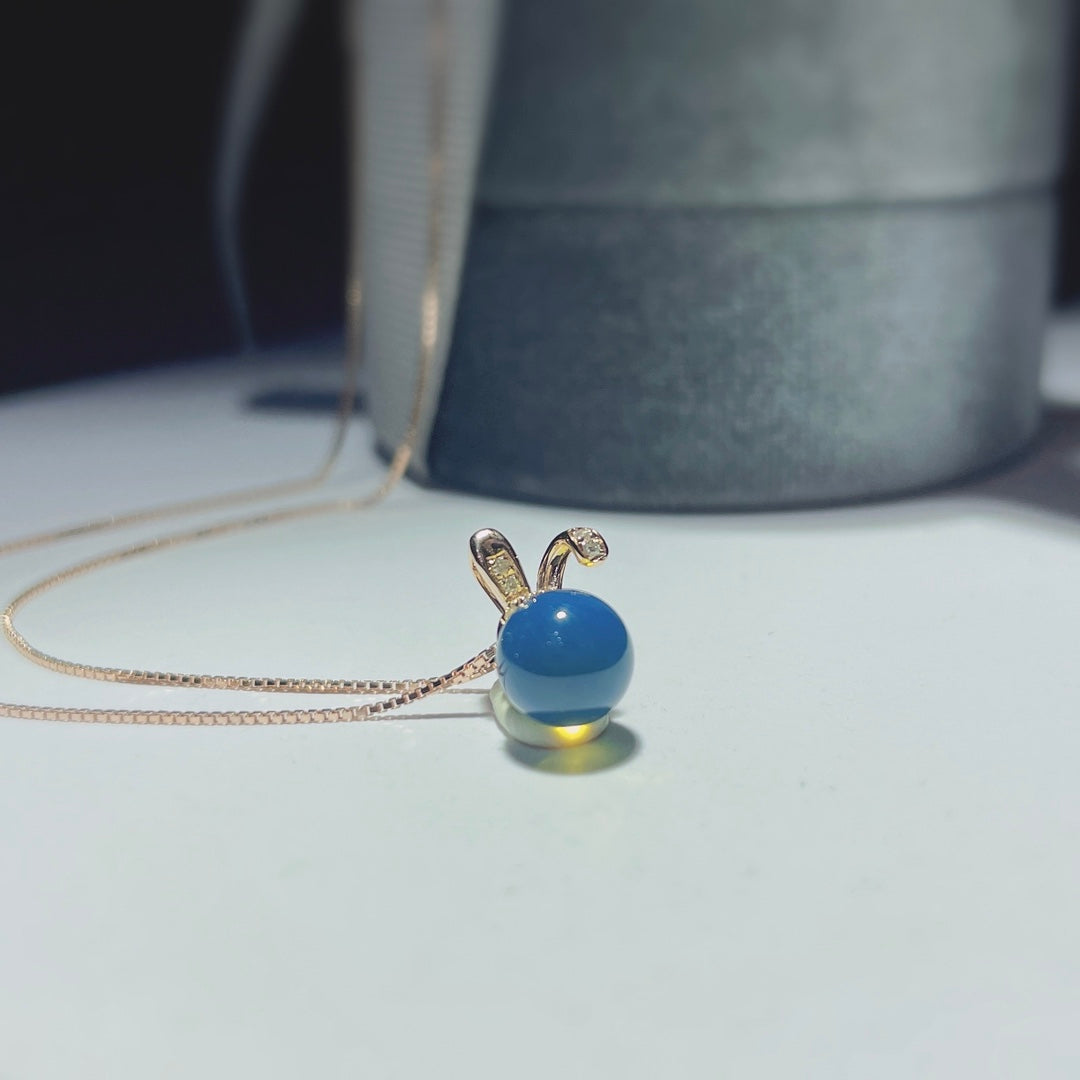 Autumn's Whisper Jewelry: 18k Gold Embedded Dominican Blue Amber Pendant with Adorable Rabbit