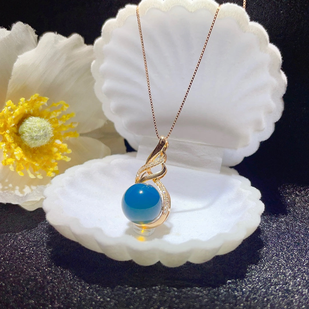 Bijoux exquis avec pendentif en ambre bleu dominicain intégré en or 18 carats