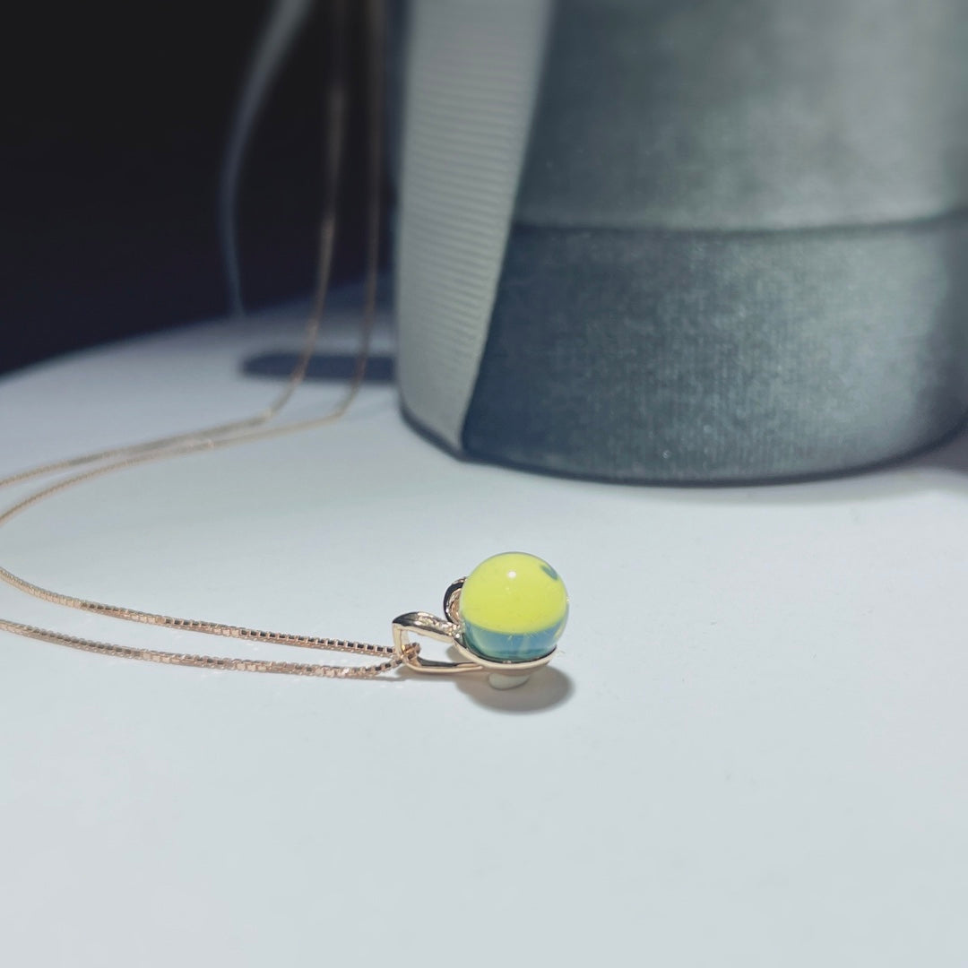Autumn's Whisper Jewelry: 18k Gold Embedded Dominican Blue Amber Pendant with Adorable Rabbit