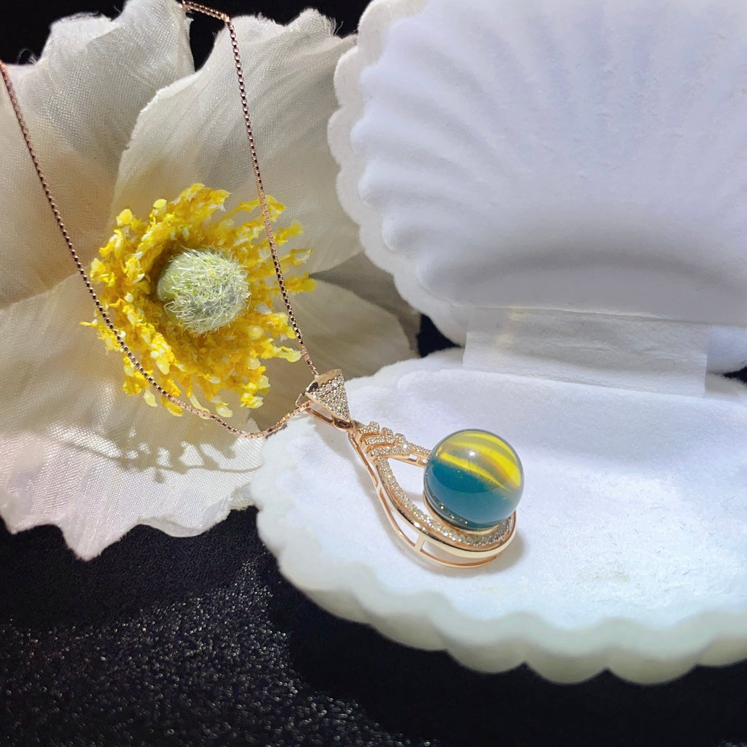 Colgante de Ámbar Azul Dominicana Incrustado en Oro de 18K - Joyería Exquisita