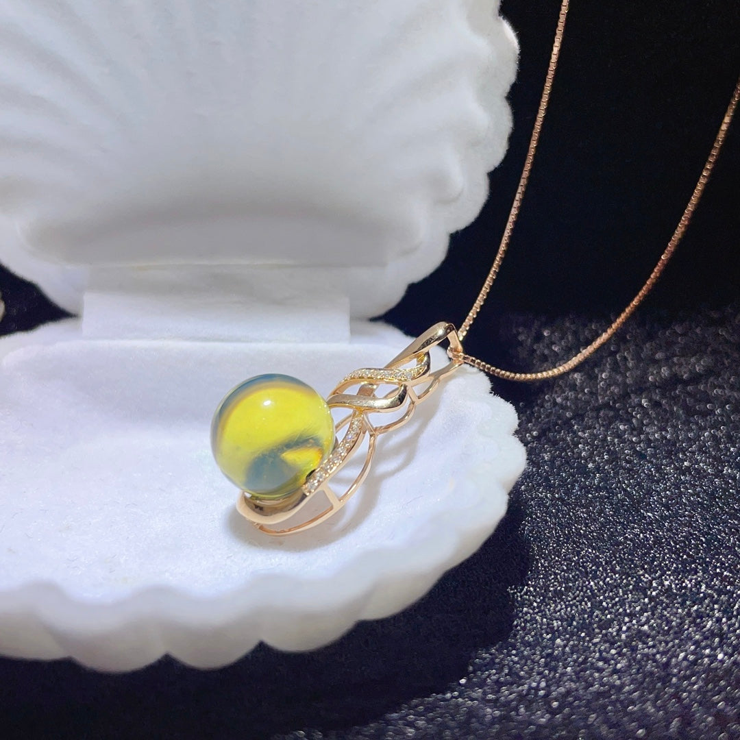 Bijoux exquis avec pendentif en ambre bleu dominicain intégré en or 18 carats