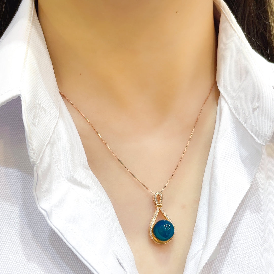 Colgante de Ámbar Azul Dominicana Incrustado en Oro de 18K - Joyería Exquisita